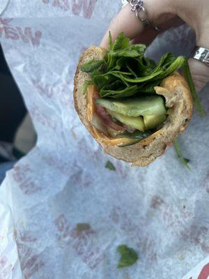 wheat shorti roll w/ cheddar cheese, spinach, tomato, pickles, cucumbers, and roasted veggies