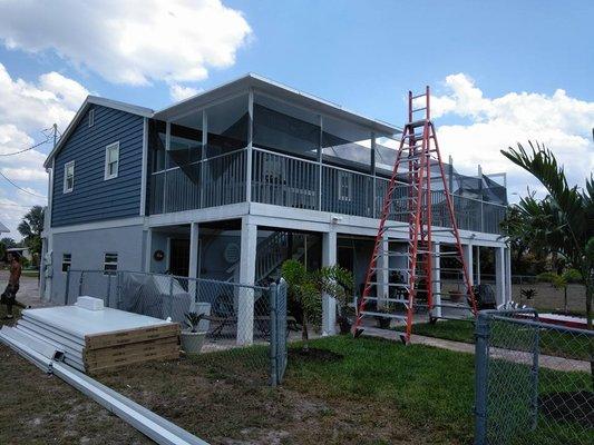 Installing new white, Elite roofing