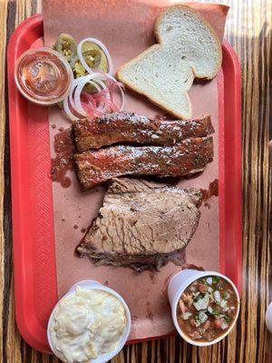 2 meat plate with brisket and pork ribs. Brisket beans and banana pudding on the side!