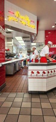 Hard at work making delicious So Cal Fresh to order burgers and fries.