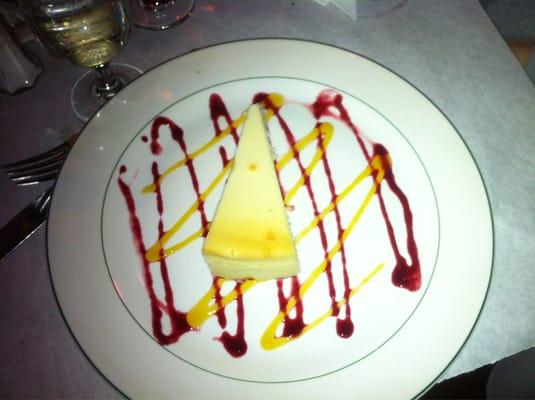 Cheesecake drizzled w/ strawberry & mango syrup.