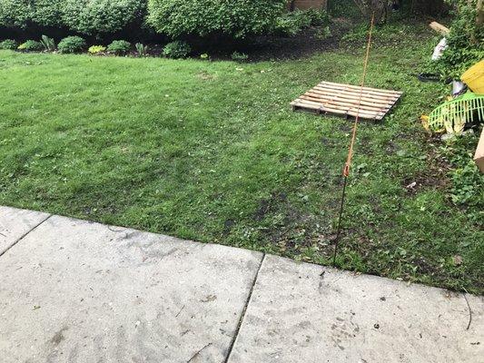 Rope=property line. My property on left. Job site on right. Note tracks in my lawn and position of pallet (after I removed shingles)