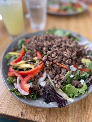 Mixed greens with steak