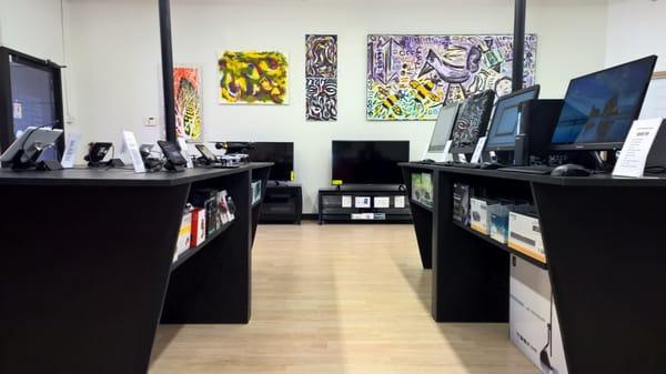 A quick peek at our showroom, featuring art by Mark Rohlf.