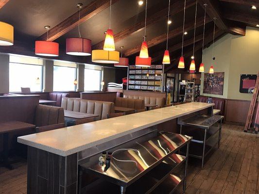 Come in and see our newly remodeled Denny's restaurant. A view of the counter and dining room.