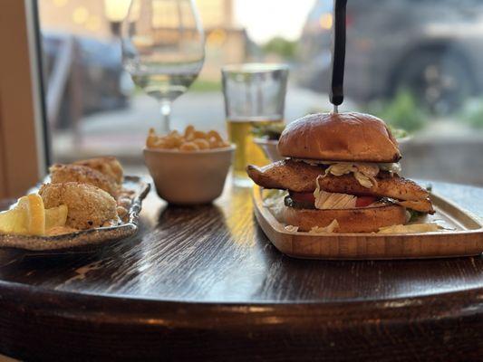 Crab cakes with macaroni on the side, grouper sandwich,