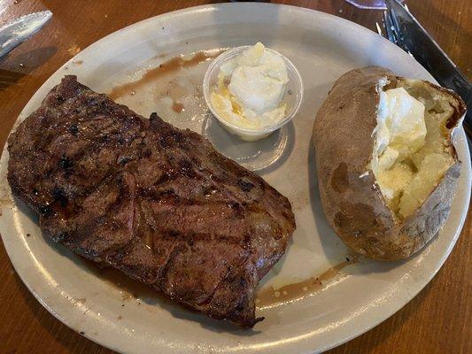 Ribeye 12oz baked potato medium rare. Delicious