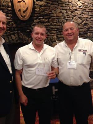 Mr. Schneider and Michael with the Gold Dealer award from HVAC 2014