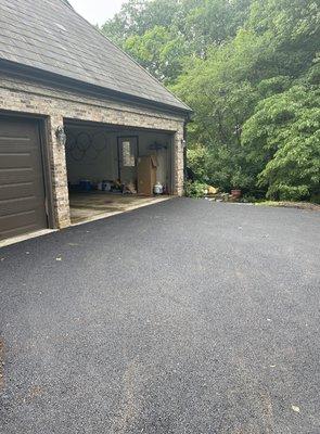 Old asphalt sunk by garage door and now it is level