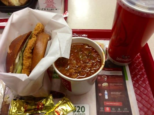 Spicy chicken on a pretzel roll and chili.