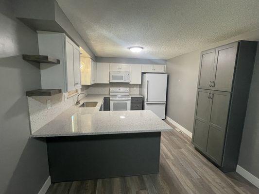 Clean White paint and soft grey stain Shaker cabinets