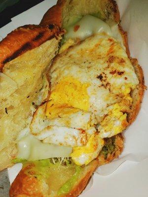 Eggepensive Large egg, provolone cheese, sprouts & avocado in croissant