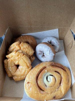 Glazed Cinnamon Roll, Vanilla Iced Cake, Glazed Raised, and Old Fashioned