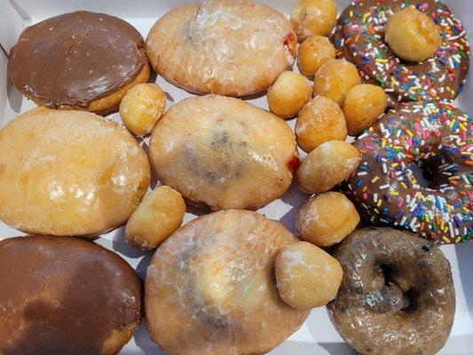 Variety of donuts and donut holes.