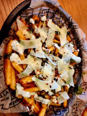 Chimi Fries
 
 A basket of seasoned fries topped with garlic ranch, chimichurri, red pepper flakes, and shaved parmesan.