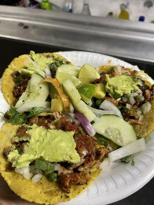 Al pastor tacos and carne asada taco