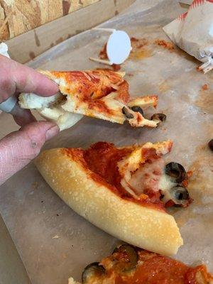 Cheese less pizza with folded crust. Yuk, disgusting and should be embarrassing