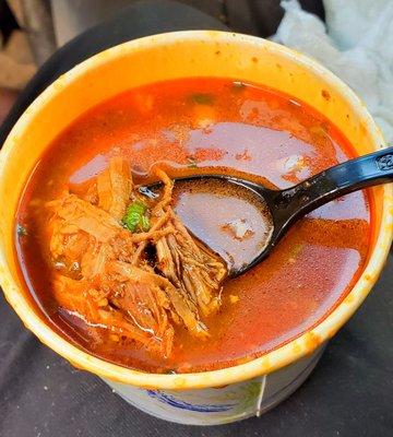 Consume with melt in your mouth Birria beef. Wonderful, slightly spicy flavor, with a nice hint of cilantro. Really delicious.