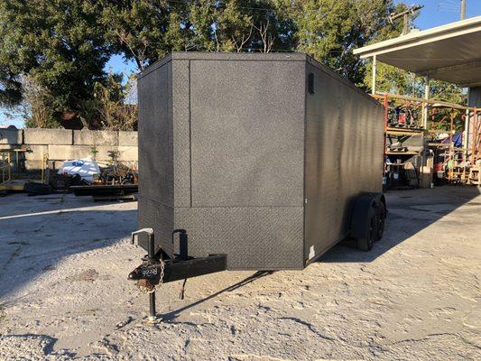 Enclosed trailer fenders and front face sprayed with Bullet Liner.