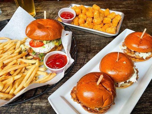 The Founders Burger with fries (left) and Fried Chicken Sliders with tater tots