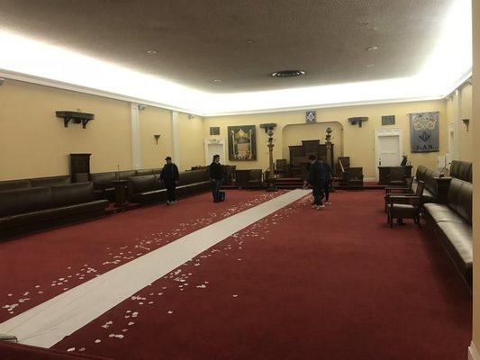 Lodge room setting up for wedding ceremony.