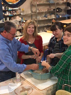 These students are having fun at there pottery class