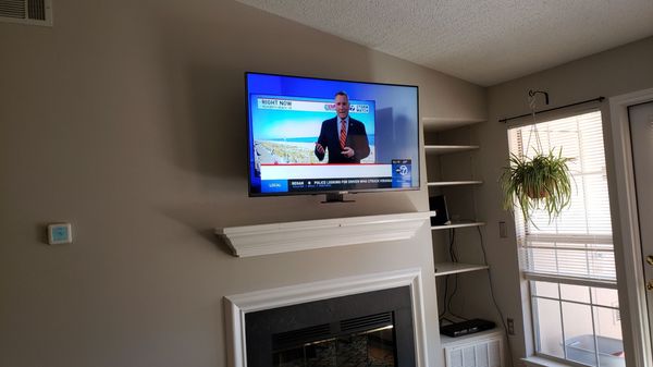 55" TV over fireplace with MantelMount.