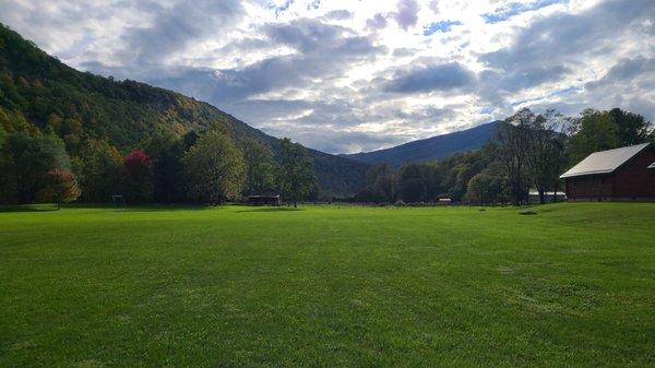 Field and play area behind the cabins