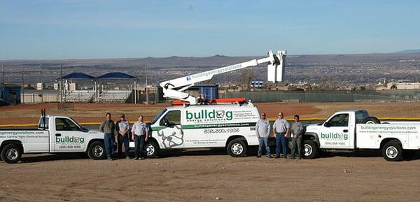 Some of the BES crew and our work vehicles