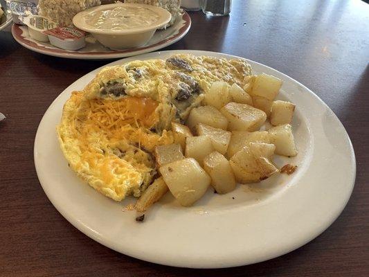 Meat lovers omelette with home fries