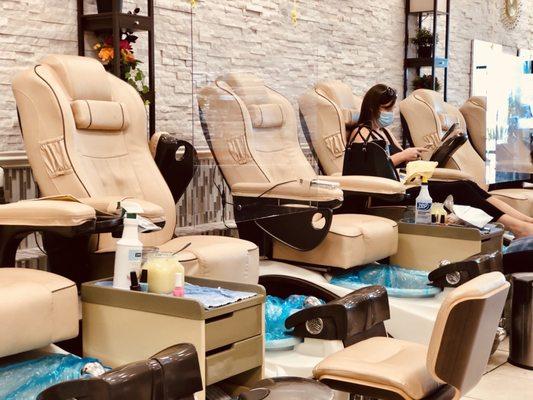 Pedicure stations w/ shields for pandemic protection though the bowls have always been changed with a new plastic lining for yrs