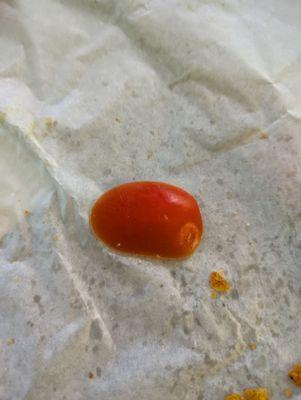 End piece of the tomato in the sandwich. I just took it out and threw it away.