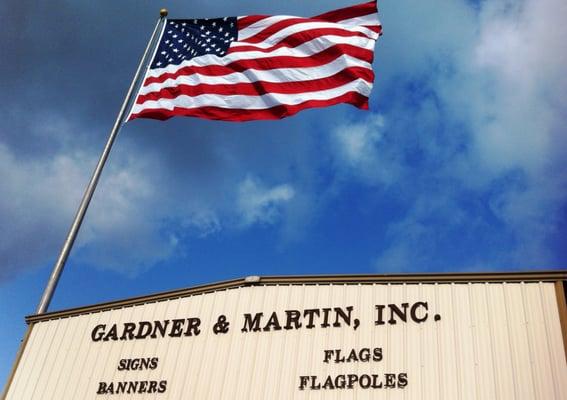 Gardner & Martin proudly flying the American Flag above its business.