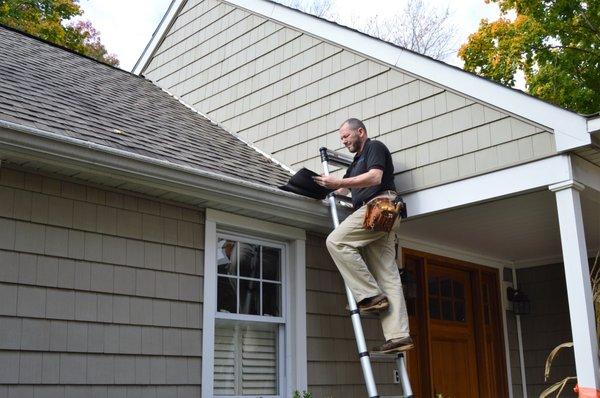 Inspecting the roof.