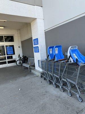 Walmart bench entrance with carts-