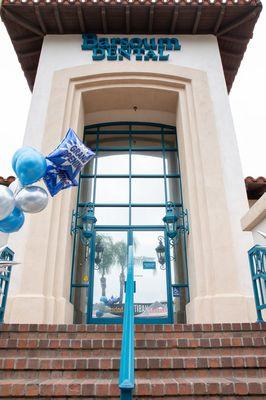 Exterior of office with Grand Opening balloons