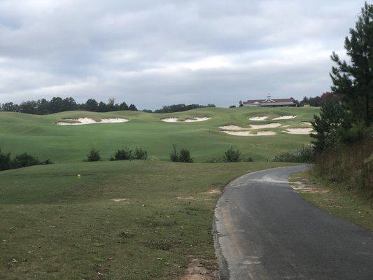 #18, 387 yard par 4, lined with fairway bunkers and green side bunkers.