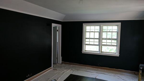 Repaired and paint black walls white trim in Oak Park