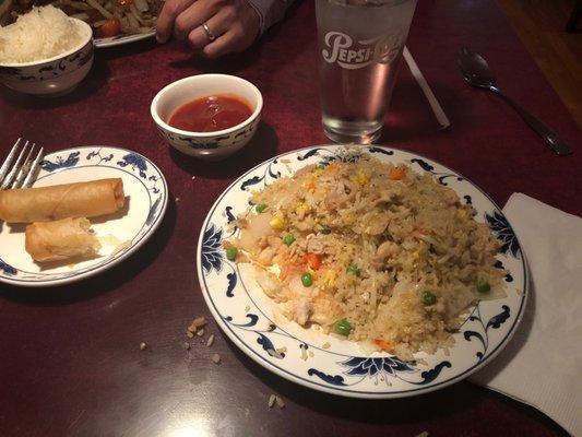 Chicken fry rice with vegetables and spring rolls