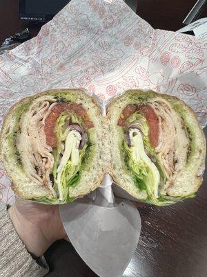 South Boston sandwich with lettuce, tomato, red onions, pesto on a sub roll