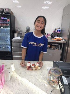 One of the very helpful employees who has an eye for artistic design of ice cream sundaes and is very polite .