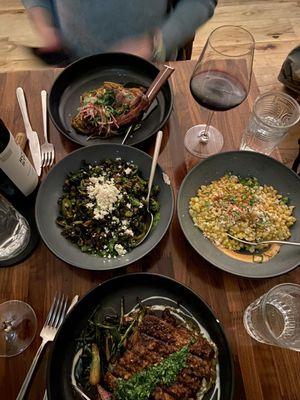 Top to bottom: borrego con fideos (lamb), Brussels sprouts, esquites and carne asada