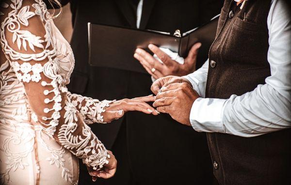 "With this ring, I thee wed." 
Photo Credit: Faith Harbour Photography