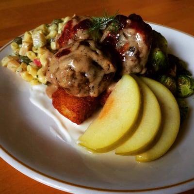 Stockholm plate. Swedish meatballs, caper dill mac salad, house made tater tots, Brussels sprouts and a pickled apple.