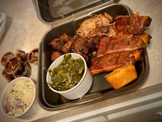 3 Meats BBQ Plate - Ribs, Burnt Ends, Pork BBQ; Collard Greens, Redskin Potato Salad & Corn Muffin... extra to go sauces on the left