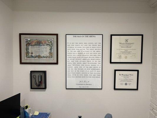 Framed pictures and diplomas