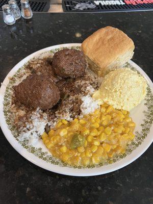 Meatball stew with potato salad and corn