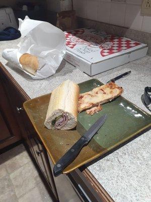 Dry pizza and a ham and bread sandwich. $22 for this? Booo