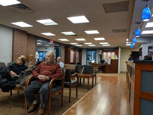 Waiting area and check-in desk to the right