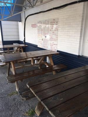 Some outside picnic tables